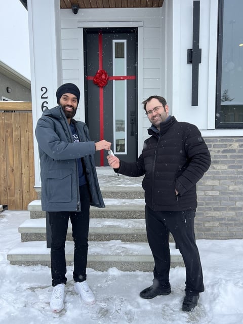 Key handover — luxury custom home by Bright Custom Homes, Hillhurst
