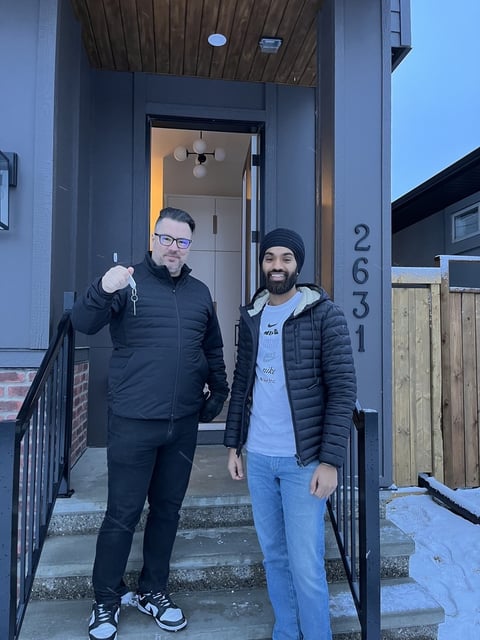 Key handover — luxury custom home by Bright Custom Homes, Hillhurst