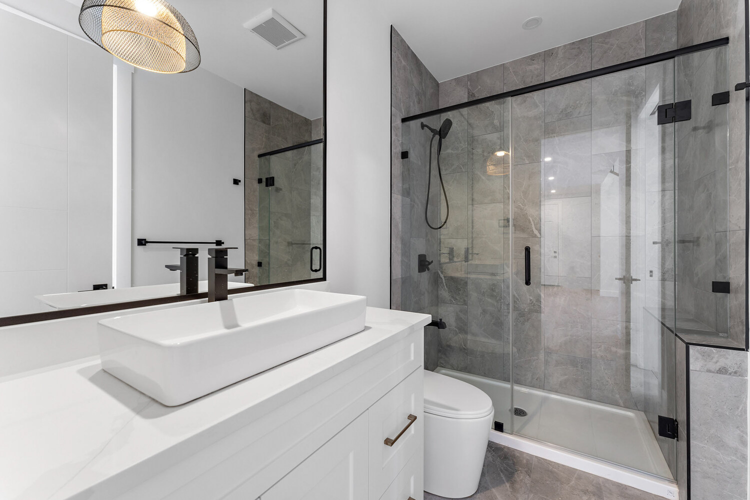 Luxury bathroom remodel with walk-in shower and vessel sink in Altadore, Calgary by Bright Custom Homes